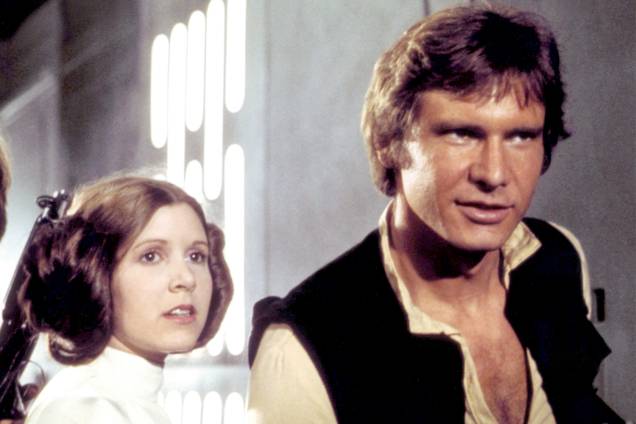 Carrie Fisher e Harrison Ford, em cena do filme 'Star Wars IV - Uma Nova Esperança' - 1977 Carrie Fisher e Harrison Ford, em cena do filme 'Star Wars IV - Uma Nova Esperança' - 1977