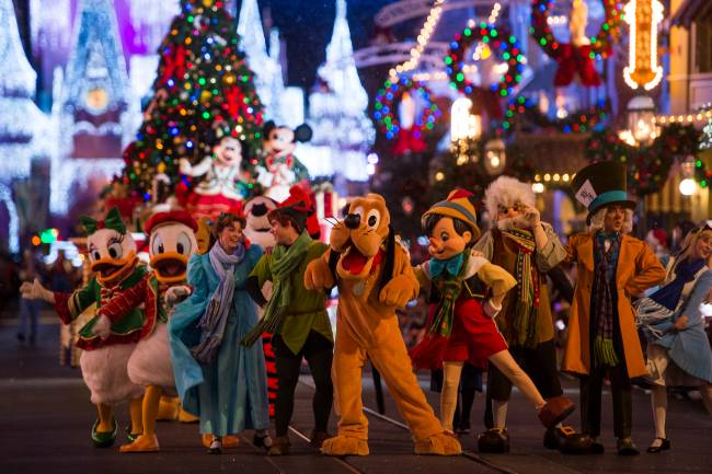 Disney characters dressed in their holiday finest parade down Main Street, U.S.A., at Magic Kingdom during "Mickey's Once Upon a Christmastime Parade." The festive processional is one of the happy highlights of Mickey's Very Merry Christmas Party, a night of holiday splendor with lively stage shows, a unique holiday parade, Holiday Wishes: Celebrate the Spirit of the Season nighttime fireworks, and snow flurries on Main Street, U.S.A. The special-ticket event takes place on select nights in November and December in Magic Kingdom at Walt Disney World Resort in Lake Buena Vista, Fla. (Charlie Champagne, photographer)