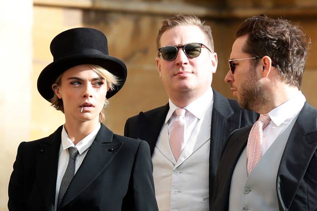 A modelo britânica Cara Delevingne chega para o casamento da princesa Eugenie de York com Jack Brooksbank na Capela de São Jorge, no Castelo de Windsor - 12/10/2018 A modelo britânica Cara Delevingne chega para o casamento da princesa Eugenie de York com Jack Brooksbank na Capela de São Jorge, no Castelo de Windsor - 12/10/2018