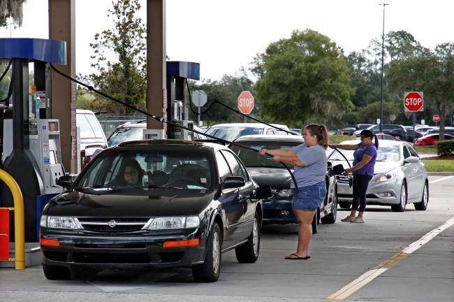 Local residents get gas ahead of the arrival of Hurricane Dorian in Kissimmee