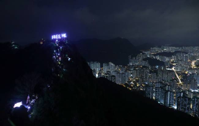 Anti-government protesters gather at Lion Rock, in Hong Kong Anti-government protesters gather at Lion Rock, in Hong Kong