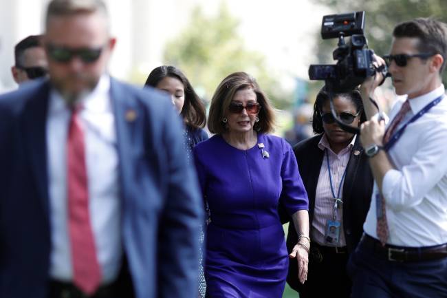 Speaker of the House Nancy Pelosi (D-CA) walks to a government vehicle after speaking at an American Federation of Government Employees labor union rally at the U.S. Capitol in Washington Speaker of the House Nancy Pelosi (D-CA) walks to a government vehicle after speaking at an American Federation of Government Employees labor union rally at the U.S. Capitol in Washington