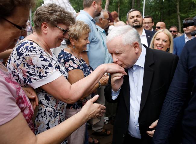 Law and Justice (PiS) leader Jaroslaw Kaczynski kisses a supporter’s hand during an election meeting in Stalowa Wola Law and Justice (PiS) leader Jaroslaw Kaczynski kisses a supporter’s hand during an election meeting in Stalowa Wola