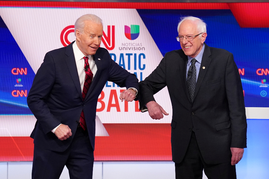 Com elogios a Sanders, Biden tenta arrecadar votos para derrotar Trump