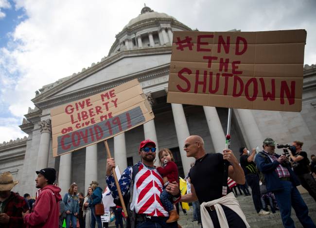 Protesters against the state’s extended stay-at-home order demonstrate in Olympia Protesters against the state’s extended stay-at-home order demonstrate in Olympia