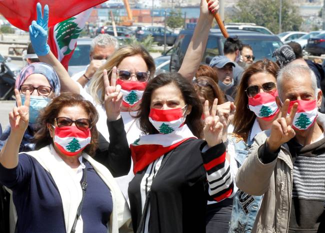 Demonstrators take part in a protest against the growing economic hardship in Beirut