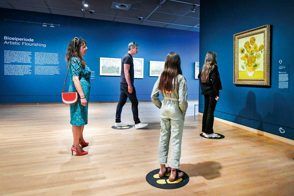 People look at Vincent van Gogh’s Sunflowers painting at the Van Gogh Museum that reopened as Netherlands eases some of the lockdown measures People look at Vincent van Gogh’s Sunflowers painting at the Van Gogh Museum that reopened as Netherlands eases some of the lockdown measures