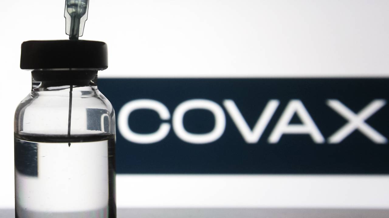 A medical syringe and a vial in front of the COVAX word are seen in this creative illustrative photo. More than one hundred fifty COVID-19 coronavirus vaccine are in development across the world, several of which have the third phase of clinical trials, as media reported. (Photo illustration by STR/NurPhoto via Getty Images)