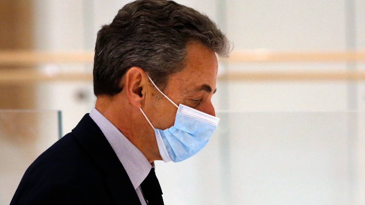 PARIS, FRANCE - DECEMBER 10: Former French President Nicolas Sarkozy leaves the court for a break for the last day of his trial on corruption charges in the so-called 'wiretapping affair' on December 10, 2020 in Paris, France. When Mr. Sarkozy first appeared in court last month, on charges of corruption and influence-peddling, he became the first French president in modern times to appear in the dock. Prosecutors allege he and a codefendant tried to bribe a magistrate in relation to a separate investigation into his party finances. Prosecutors are seeking a four-year prison term for Sarkozy, of which he would serve two. (Photo by Chesnot/Getty Images)