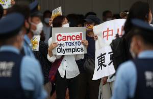 TOKYO, JAPAN JULY 23, 2021: People protest against the Tokyo 2020 Summer Olympic Games outside the National Stadium. Tokyo was to host the 2020 Summer Olympics from 24 July to 9 August 2020, however because of the COVID-19 pandemic the games have been postponed for a year and are due to take place from 23 July to 8 August 2021. Valery Sharifulin/TASS (Photo by Valery SharifulinTASS via Getty Images)