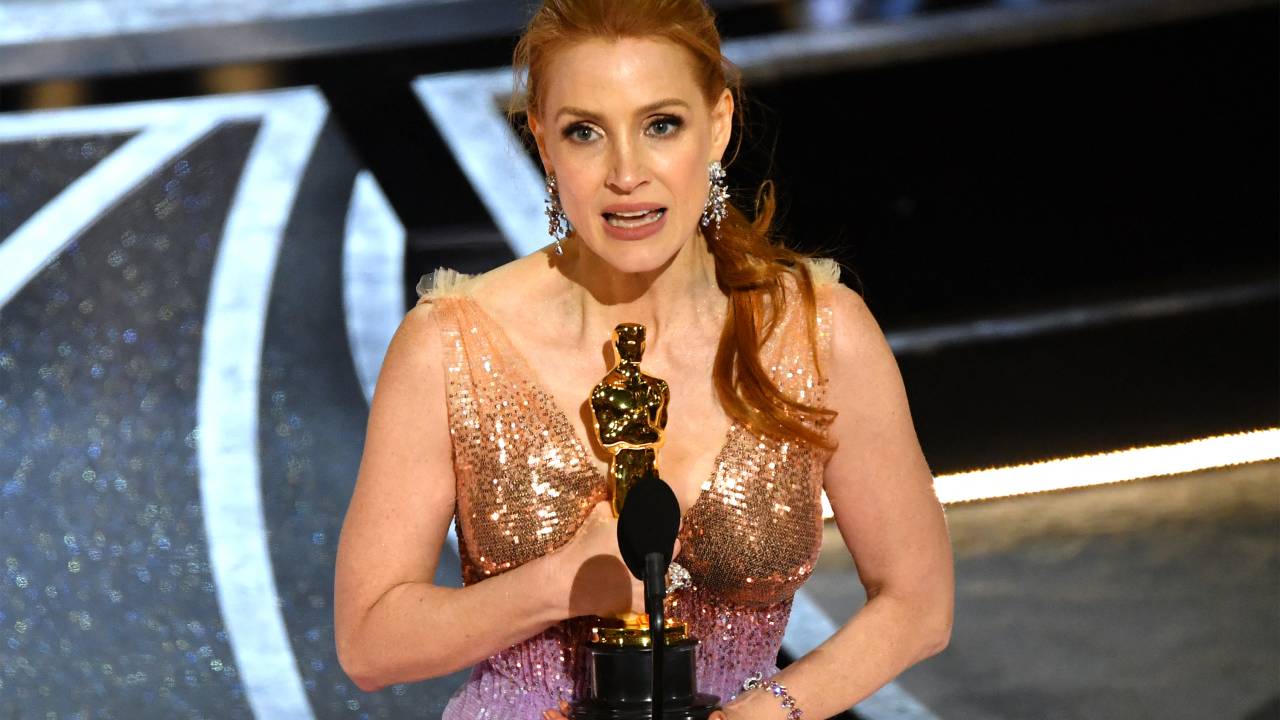 US actress Jessica Chastain accepts the award for Best Actress in a Leading Role for her performance in "The Eyes of Tammy Faye" onstage during the 94th Oscars at the Dolby Theatre in Hollywood, California on March 27, 2022. (Photo by Robyn Beck / AFP)