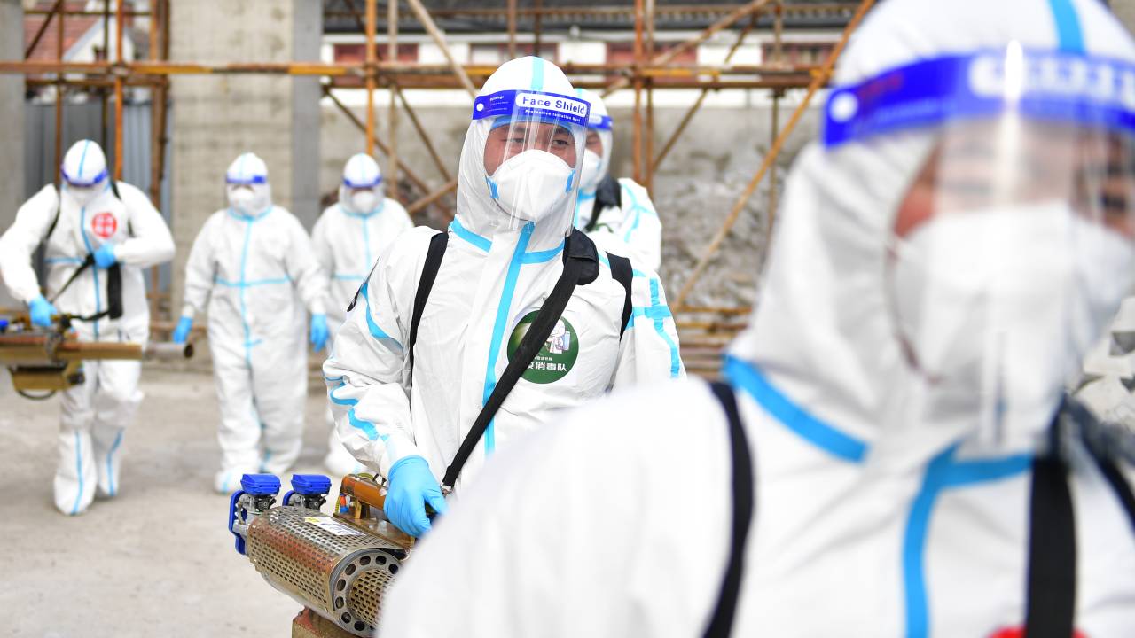 SHANGHAI, CHINA - APRIL 17: Members of a volunteer team from Lanzhou disinfect a construction site on April 17, 2022 in Shanghai, China. (Photo by Tian Yuhao/China News Service via Getty Images)