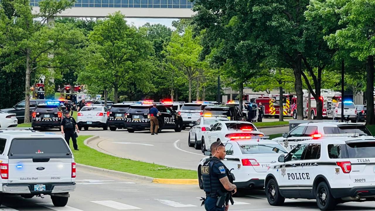 In this handout photo courtesy of Tulsa Police Department taken on June 1, 2022, Police officers respond to a call about a man armed with a rifle at the Natalie Building at St. Francis Hospital in Tulsa, Oklahoma. - A gunman killed at least four people Wednesday at a hospital campus in Tulsa, Oklahoma, police said, the latest mass shooting to convulse America coming as Texas families bury their dead after a school massacre barely one week ago.