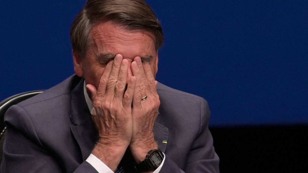 Brazil's President Jair Bolsonaro gestures during the Solemnity Installation of the Federal Regional Court of the 6th region in Belo Horizonte, Minas Gerais State, Brazil, on August 19, 2022. (Photo by DOUGLAS MAGNO / AFP)