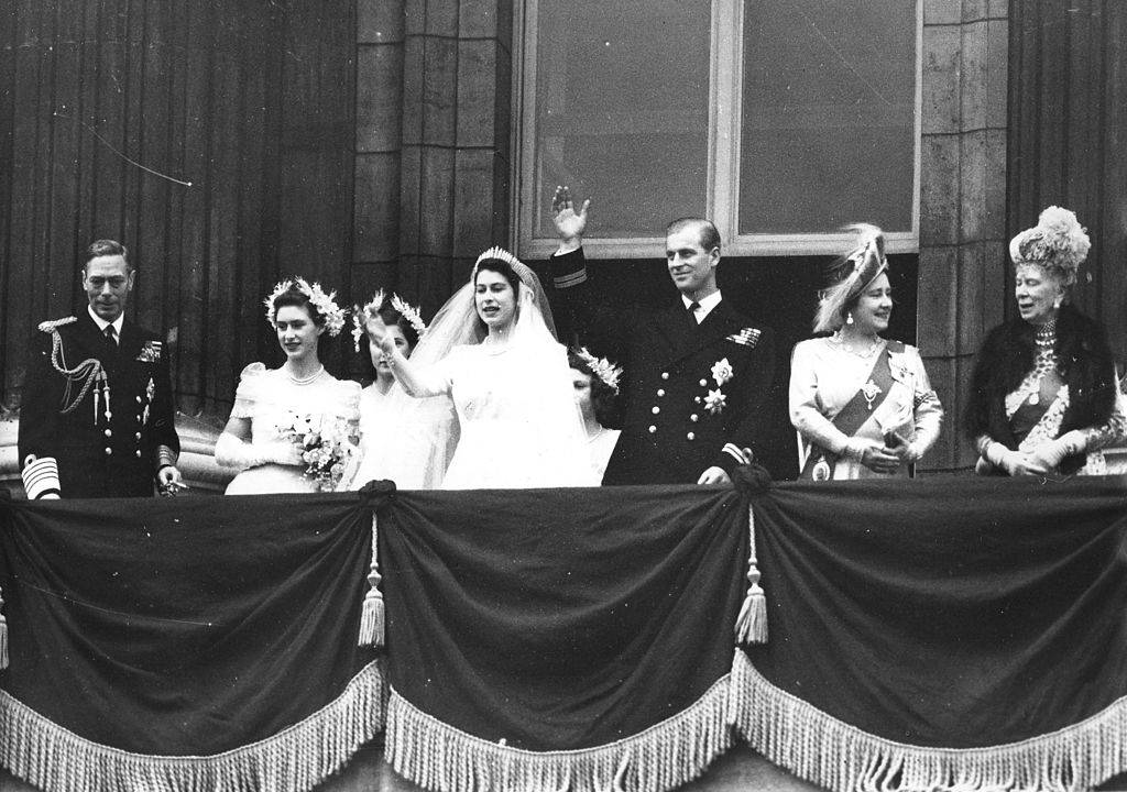 The Royal Wedding Party wave from the balcony of the Buckingham Palace, London, England, November 20, 1947. Front row, from left, King George VI (1895 - 1952), Princess Margaret (1930 - 2002), then-Princess Elizabeth (later Queen Elizabeth II), the Duke of Edinburgh, Queen Elizabeth (1900 - 2002), and Queen Mary (the Queen Mother) (18671953). (Photo by PhotoQuest/Getty Images)