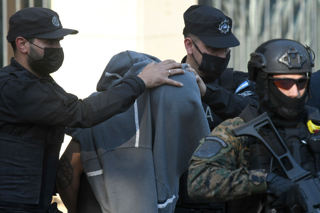 BUENOS AIRES, ARGENTINA - SEPTEMBER 14: Fernando Sabag Montiel leaves the Comodoro Py courts escorted by police officers on September 14, 2022 in Buenos Aires, Argentina. After an attack on Vice President Cristina Fernandez de Kirchner, Federal Judge MarÌa Eugenia Capuchetti and General Attorney Carlos RÌvolo carry on an investigation where so far Fernando AndrÈ Sabag Montiel and his partner Brenda Uliarte remain under custody. (Photo by Gustavo Garello/Getty Images)