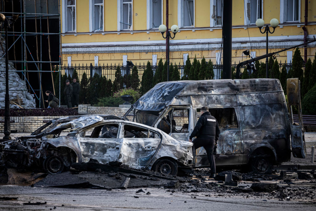 KYIV, UKRAINE - OCTOBER 10: Emergency service personnel attend to the site of a blast on October 10, 2022 in Kyiv, Ukraine. This morning's explosions, which came shortly after 8:00 local time, were the largest such attacks in the capital in months. (Photo by Ed Ram/Getty Images)