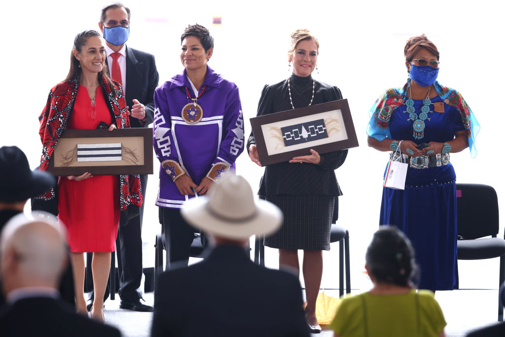 MEXICO CITY, MEXICO - AUGUST 13: (L-R) Claudia Sheinbaum, Kahsennenhawe Sky-Deer, Beatriz Gutierrez Mueller and Jamescita Mae Peshalakai attend a ceremony to commemorate the 500 years of indigenous resistance in Mexico at Zocalo on August 13, 2021 in Mexico City, Mexico. On august 13, 1521, Spanish conquerors commanded by Hernan Cortes and allied with thousands of local indigenous captured the cities of Tenochtitlan and Tlatelolco, considered as the conquest of Mexico-Tenochtitlan. President Lopez Obrador and his government decided to commemorate the date not as a remembrance of the fall of the Mexica empire but as the 500-year of indigenous resistance in the country. (Photo by Hector Vivas/Getty Images)