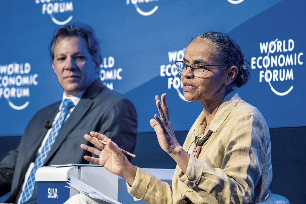 000_33796AZ.jpg ESFORÇO - Haddad e Marina em Davos: tentativa de vender otimismo sobre o país -