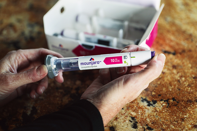 CARLSBAD, CA-NOV 30TH: Rachel Graham holds a Mounjaro injectible pen at her home in Carlsbad, CA on Wednesday, November 30, 2022. Graham has battled excess weight for years, cycling through trendy diets, various drugs, and even bariatric surgery. she started a new medication, Mounjaro, and now is 30 pounds lighter(Photo by Sandy Huffaker for The Washington Post via Getty Images)