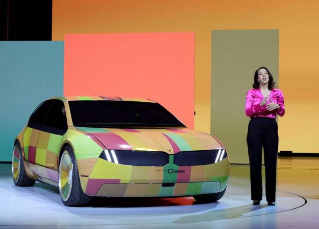 Las Vegas Hosts Annual CES Trade Show LAS VEGAS, NEVADA - JANUARY 04: BMW project manager Stella Clarke introduces the color-changing ability of the BMW i Vision Dee (Digital Emotional Experience) concept EV sport sedan during a keynote address by Chairman of the Board of Management of BMW AG Oliver Zipse at CES 2023 at The Pearl concert theater at Palms Casino Resort on January 04, 2023 in Las Vegas, Nevada. CES, the world's largest annual consumer technology trade show, runs from January 5-8 and features about 3,100 exhibitors showing off their latest products and services to more than 100,000 attendees. (Photo by Ethan Miller/Getty Images)