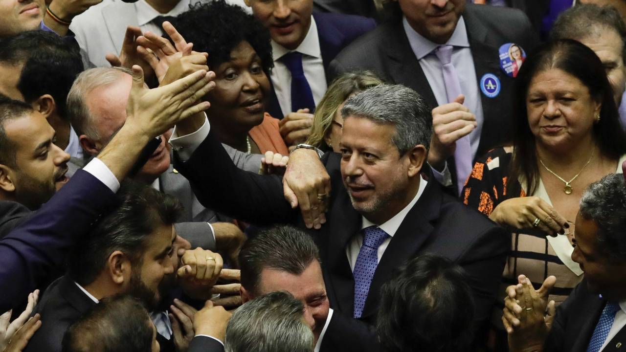 Brazilian deputy Arthur Lira greets deputies after being re-elected as President of the Chamber of Deputies at the National Congress in Brasilia, on February 1, 2023. (Photo by Sergio Lima / AFP)