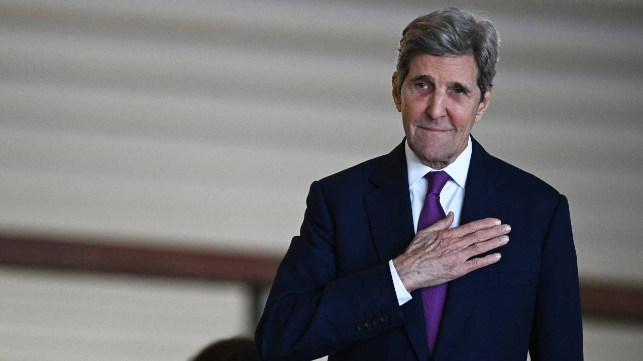 US Special Presidential Envoy for Climate John Kerry gestures as he arrives to the Itamaraty Palace in Brasilia to meet Brazilian Vice President Geraldo Alckmin and Minister of Environment Marina Silva, on February 27, 2023. - Among the points that will be addressed during Kerry's visit is the US intention to provide resources for conservation and preservation programmes in the Amazon, including the contribution of resources to the Amazon Fund. (Photo by EVARISTO SA / AFP)