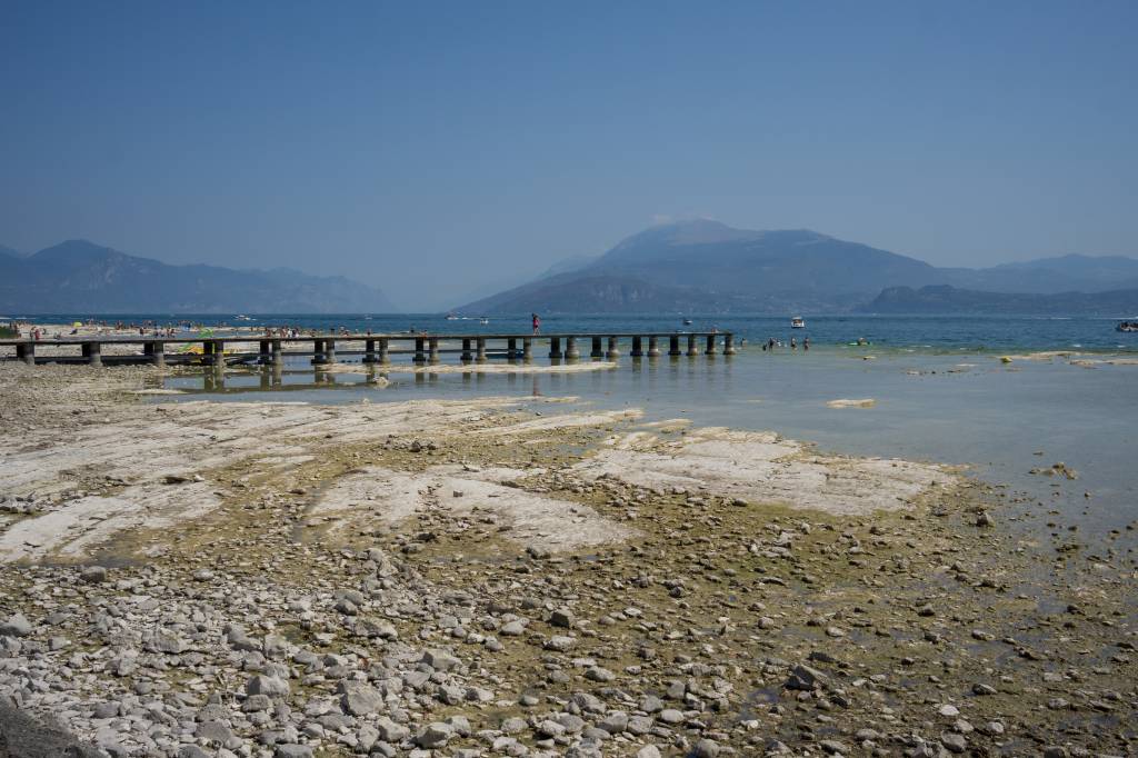 Coast with low water at lake Garda in italy xxx