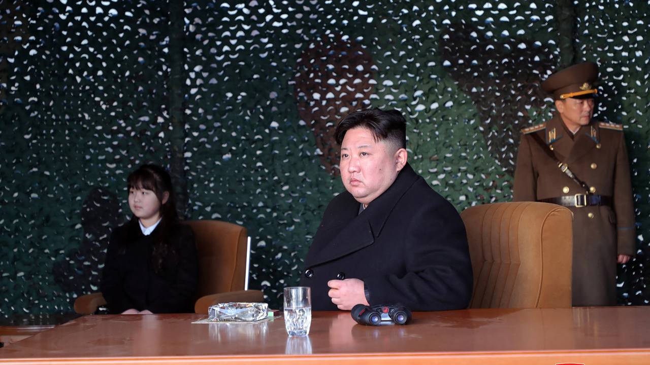 This picture taken on March 9, 2023 and released by North Korea's official Korean Central News Agency (KCNA) on March 10 shows North Korea's leader Kim Jong Un (C) and his daughter (L) observing the Mars Artillery Unit, responsible for important operational missions of the Korean People's Army Western Front, as it conducts fire attack training, at an undisclosed location. (Photo by KCNA VIA KNS / AFP) / South Korea OUT / ---EDITORS NOTE--- RESTRICTED TO EDITORIAL USE - MANDATORY CREDIT "AFP PHOTO/KCNA VIA KNS" - NO MARKETING NO ADVERTISING CAMPAIGNS - DISTRIBUTED AS A SERVICE TO CLIENTS / THIS PICTURE WAS MADE AVAILABLE BY A THIRD PARTY. AFP CAN NOT INDEPENDENTLY VERIFY THE AUTHENTICITY, LOCATION, DATE AND CONTENT OF THIS IMAGE --- /