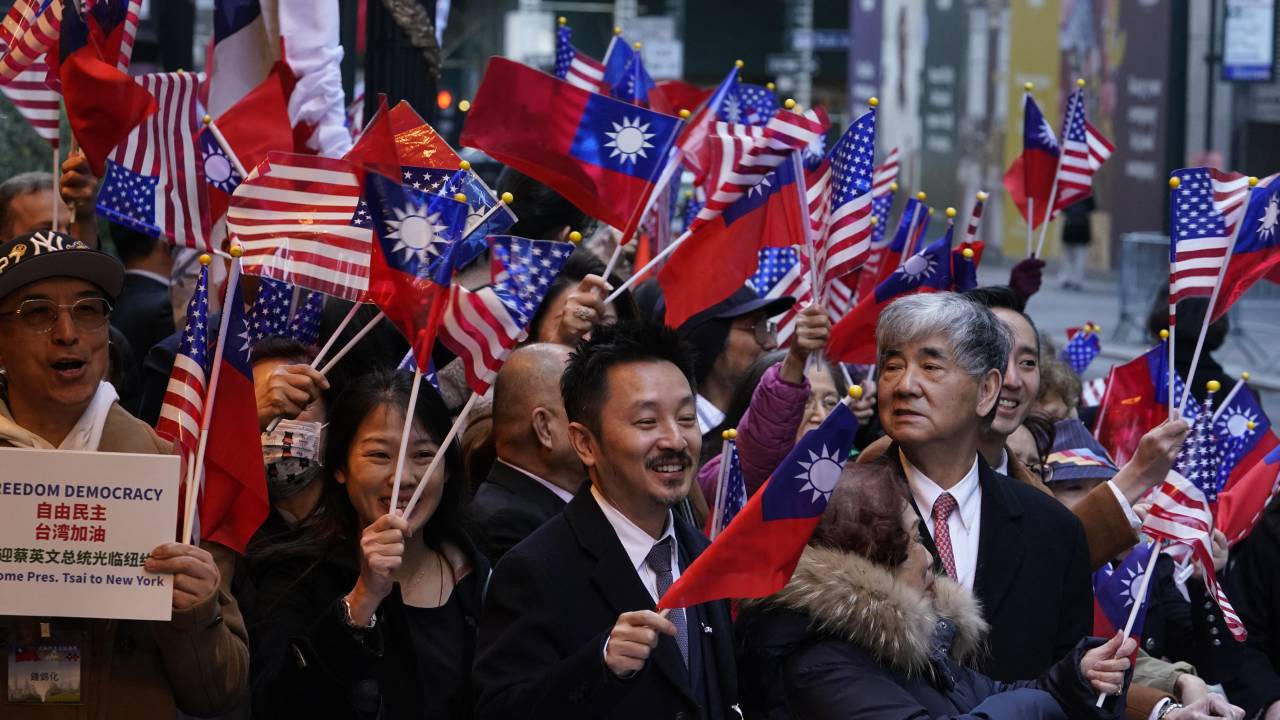 Supporters look on as Taiwan's President Tsai Ing-wen, not pictured, arrives at her hotel in New York City on March 29, 2023, as she begins a ten day international trip. (Photo by TIMOTHY A. CLARY / AFP)