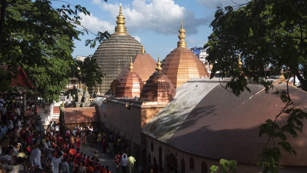 GUWAHATI, INDIA - AUGUST 19: Priests dance in the beat of Dhol (Drum) during the annual three-day-long Deodhani festival at the Kamakhya Temple on August 19, 2022 in Guwahati, India. The Deodhani festival is dedicated to Serpent Goddess Kamakhya, people believed that Goddess Kamakhya fulfills the wishes of the devotees who participate in this festival. (Photo by David Talukdar/Anadolu Agency via Getty Images)