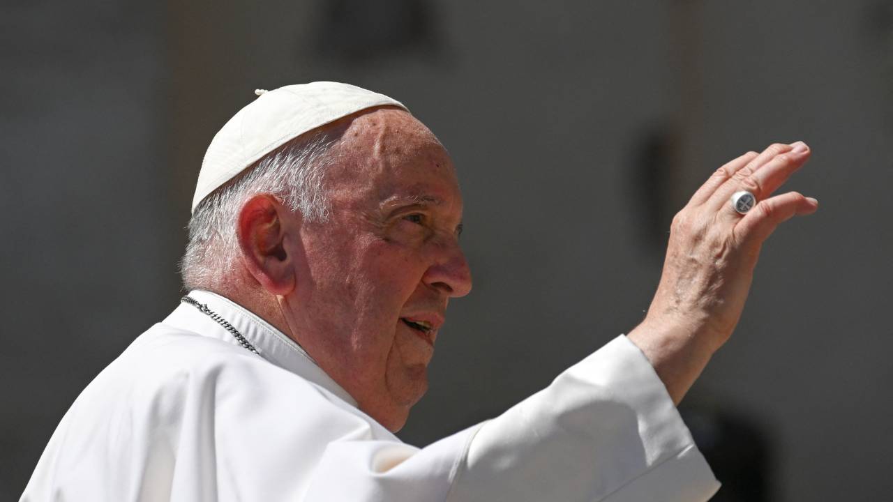 Pope Francis waves as he leaves at the end of the weekly general audience on June 7, 2023 at St. Peter's square as in The Vatican. Pope Francis will undergo an operation for an abdominal hernia on June 7 at a Rome hospital, where he is expected to stay for "several days", the Vatican said. (Photo by Andreas SOLARO / AFP)
