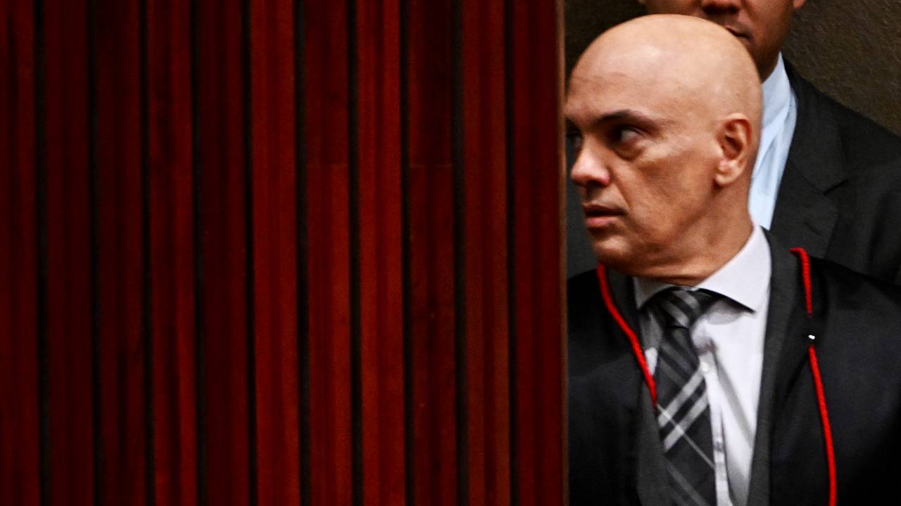 Superior Electoral Court President, Alexandre de Moraes, gestures on his arrival to the court before the beginning of the trial of Brazilian former President Jair Bolsonaro, accused of abuse of power and misinformation, in Brasilia on June 22, 2023. Brazil's electoral court began delivering its ruling Thursday on charges ex-president Jair Bolsonaro broke the law with his unproven allegations against the voting system, a case that could eliminate him from the 2026 presidential race. The Superior Electoral Tribunal (TSE) is trying the far-right former president on charges he abused his office and misused state media when, in July 2022 -- three months from elections he would go on to lose -- he convened foreign diplomats for a meeting at which he insisted Brazil's electronic voting machines were susceptible to large-scale fraud. (Photo by EVARISTO SA / AFP)
