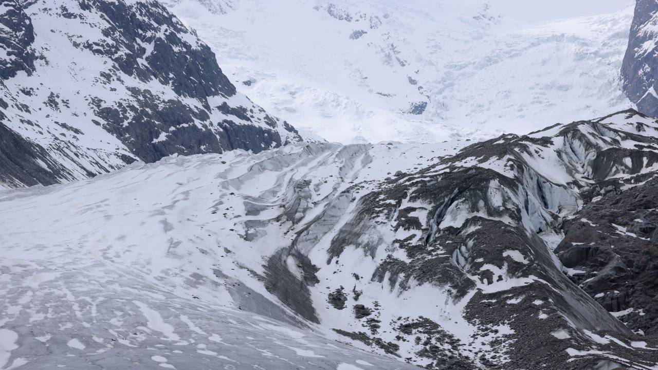 PONTRESINA, SWITZERLAND - MAY 21: The receding Morteratsch glacier lies on May 21, 2023 near Pontresina, Switzerland. On June 18 Swiss voters will go to the polls to decide on the so-called Glacier Initiative, launched by the Swiss Association for Climate Protection, which would require Switzerland to end greenhouse gas emissions and fossil fuel consumption by 2050. The Morteratsch glacier, which lies in the Bernina mountain range and is the third largest glacier in the Eastern Alps, has been receding since 1900, though the rate of its melting has accelerated in recent decades. Matthias Huss, a glaciologist with ETH Zurich university and head of the Swiss glacier monitoring network, estimates the Morteratsch lost up to 10% of its volume in 2022 alone. (Photo by Sean Gallup/Getty Images)