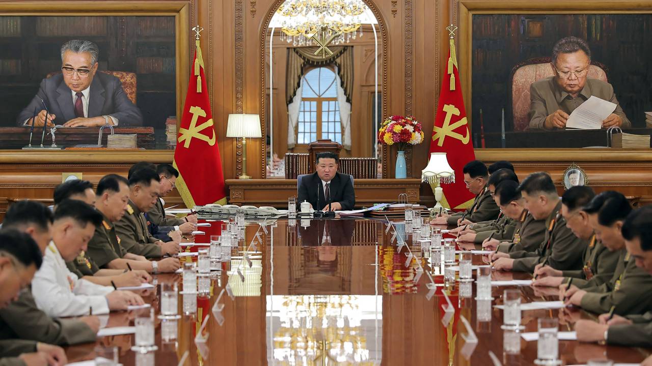This picture taken on August 9, 2023 and released from North Korea's official Korean Central News Agency (KCNA) on August 10, 2023 shows North Korea's leader Kim Jong Un (C) presiding over a plenary session of the Central Military Commission of the Workers' Party of Korea in Pyongyang. (Photo by KCNA VIA KNS / AFP) / South Korea OUT / REPUBLIC OF KOREA OUT---EDITORS NOTE--- RESTRICTED TO EDITORIAL USE - MANDATORY CREDIT "AFP PHOTO/KCNA VIA KNS" - NO MARKETING NO ADVERTISING CAMPAIGNS - DISTRIBUTED AS A SERVICE TO CLIENTS / THIS PICTURE WAS MADE AVAILABLE BY A THIRD PARTY. AFP CAN NOT INDEPENDENTLY VERIFY THE AUTHENTICITY, LOCATION, DATE AND CONTENT OF THIS IMAGE --- /