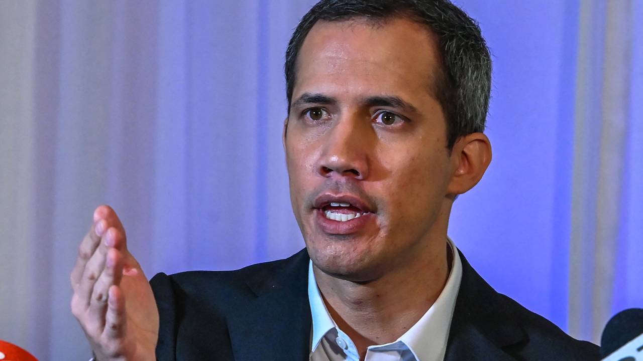 (FILES) Venezuelan opposition politician Juan Guaido speaks to the press in Miami, Florida, on April 27, 2023. The Venezuelan prosecutor's office said it had issued an arrest warrant for opposition leader Juan Guaido and would ask for Interpol's help in his apprehension, on October 5, 2023. Prosecutors were appointed "to issue an arrest warrant against him and to request a Red Notice from Interpol so that he pays for his crimes," Prosecutor Tarek William Saab said. Living in exile in the United States, Guaido was accused of treason, usurpation of functions, money laundering and association with a view to committing a crime, the official said. (Photo by Giorgio Viera / AFP)