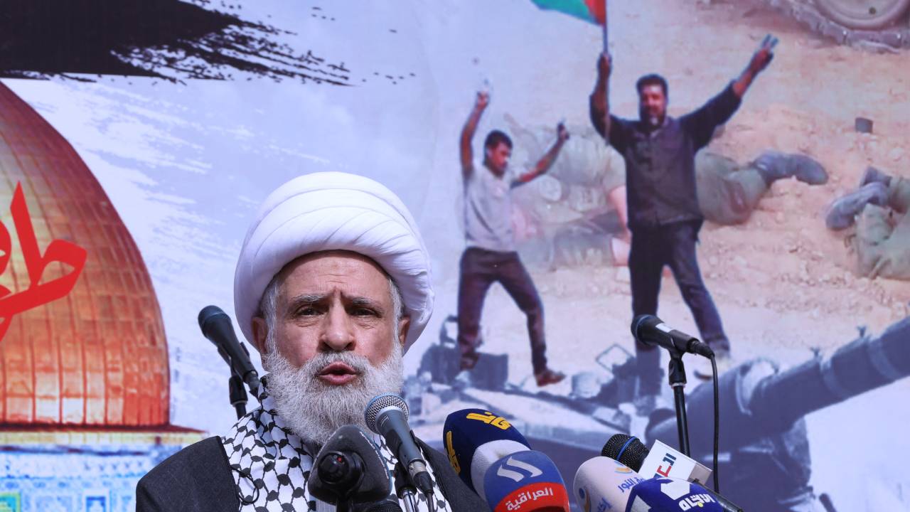 The deputy chief of Lebanon's Shiite militant group Hezbollah, Sheikh Naim Qassem, delivers a speech during a rally in Beirut on October 13, 2023, as thousands of protesters poured onto the streets of several Middle East capitals in support of Palestinians amid Israeli air strikes on Gaza in reprisal for a surprise Hamas attack. Thousands of people, both Israeli and Palestinians have died since October 7, 2023, after Palestinian Hamas militants entered Israel in a surprise attack leading Israel to declare war on Hamas in the Gaza Strip on October 8. (Photo by ANWAR AMRO / AFP)