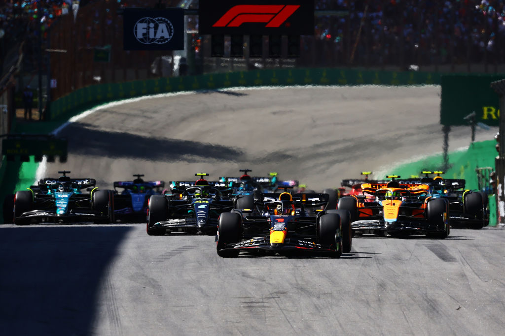 SAO PAULO, BRAZIL - NOVEMBER 05: Max Verstappen of the Netherlands driving the (1) Oracle Red Bull Racing RB19 leads Lewis Hamilton of Great Britain driving the (44) Mercedes AMG Petronas F1 Team W14 and Lando Norris of Great Britain driving the (4) McLaren MCL60 Mercedes at the restart after a red flag delay during the F1 Grand Prix of Brazil at Autodromo Jose Carlos Pace on November 05, 2023 in Sao Paulo, Brazil. (Photo by Mark Thompson/Getty Images)