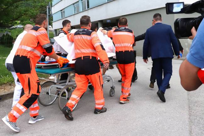Picture taken on May 15, 2024 shows Slovak Prime Minister Robert Fico being transported by medics and his security detail to the hospital in Banska Bystrica, Slovakia where he is to be treated after he had been shot 