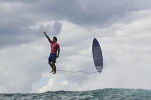 Brazil's Gabriel Medina reacts after getting a large wave in the 5th heat of the men's surfing round 3, during the Paris 2024 Olympic Games, in Teahupo'o, on the French Polynesian Island of Tahiti, on July 29, 2024. (Photo by Jerome BROUILLET / AFP)