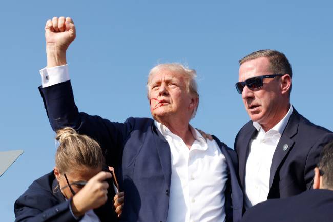 Donald Trump Holds A Campaign Rally In Butler, Pennsylvania BUTLER, PENNSYLVANIA - JULY 13: Republican presidential candidate former President Donald Trump is rushed offstage during a rally on July 13, 2024 in Butler, Pennsylvania. (Photo by Anna Moneymaker/Getty Images)