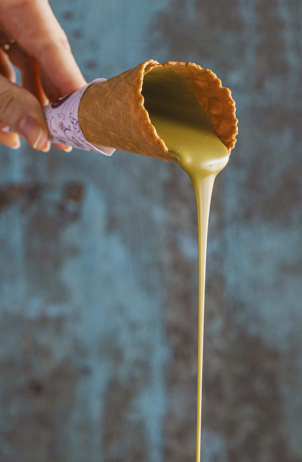 4—Casquinha-com-calda-de-pistache.jpg CLÁSSICO - Gelato da sorveteria Davvero: sabor mais pedido da casa