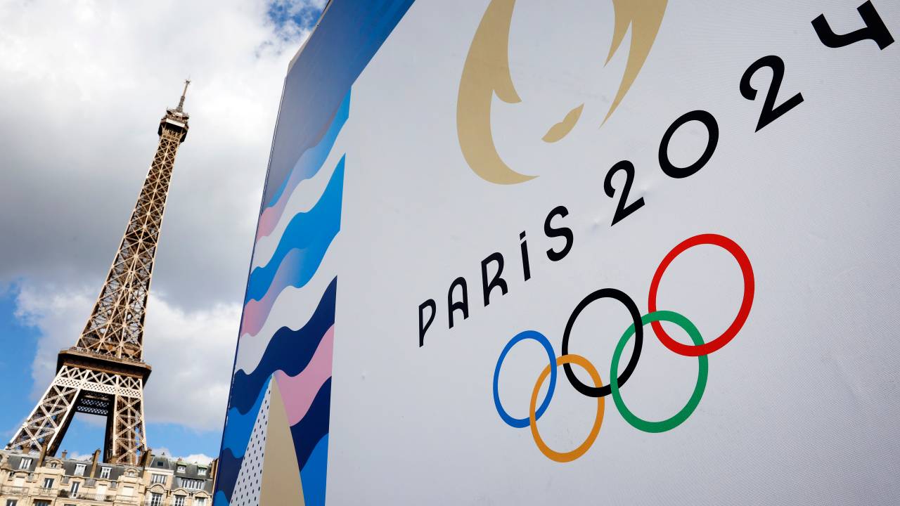 PARIS, FRANCE - APRIL 21: The Paris 2024 logo, representing the Olympic Games is displayed near the Eiffel Tower three months prior to the start of the Paris 2024 Olympic and Paralympic games on April 21, 2024 in Paris, France. The city is gearing up to host the XXXIII Olympic Summer Games, from 26 July to 11 August. (Photo by Chesnot/Getty Images)
