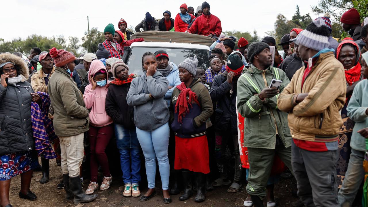 Parents and members of the community gather outside the Nyeri county's Hillside Endarasha Academy in Nyeri county on September 6, 2024 after a fire broke out killing 17 children. At least 17 children died after a fire ripped through their primary school dormitory in central Kenya, police said Friday September 06, 2024. The blaze in Nyeri county's Hillside Endarasha Academy broke out at around midnight, police said, engulfing rooms where the children were sleeping. (Photo by SIMON MAINA / AFP)