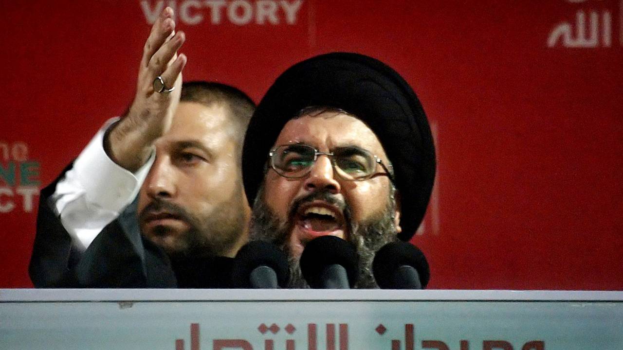 (FILES) In this file picture dated September 22, 2006, Hezbollah chief Hassan Nasrallah gestures during his speech at a massive "divine" rally in the southern suburbs of Beirut. Backed by Iran and hated by Israel, Nasrallah is Lebanon's most powerful man. Even though he has rarely been seen publicly since the 2006 war with Israel, Nasrallah enjoys cult status among his Shiite supporters, is equipped with a formidable arsenal far bigger and more modern than the national army's, and holds sway over the country's institutions. (Photo by Anwar AMRO / AFP)