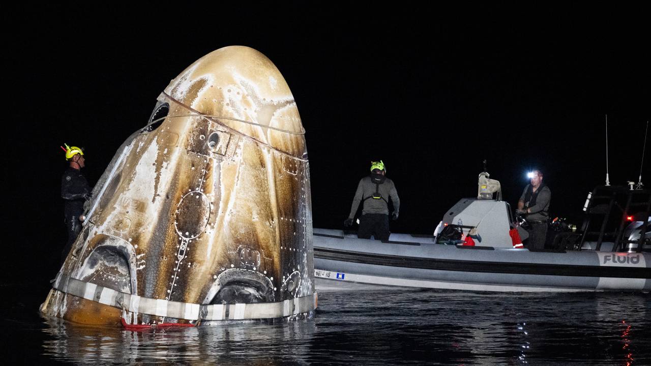 Support teams work around the SpaceX Dragon Endeavour spacecraft shortly after it landed with NASA astronauts Matthew Dominick, Michael Barratt, and Jeanette Epps, and Roscosmos cosmonaut Alexander Grebenkin aboard in the Gulf of Mexico off the coast of Pensacola, Florida, Friday, Oct. 25,2024. Dominick, Barratt, Epps, Grebenkin are returning after seven-months in space as part of Expedition 70 aboard the International Space Station. Photo Credit: (NASA/Joel Kowsky)