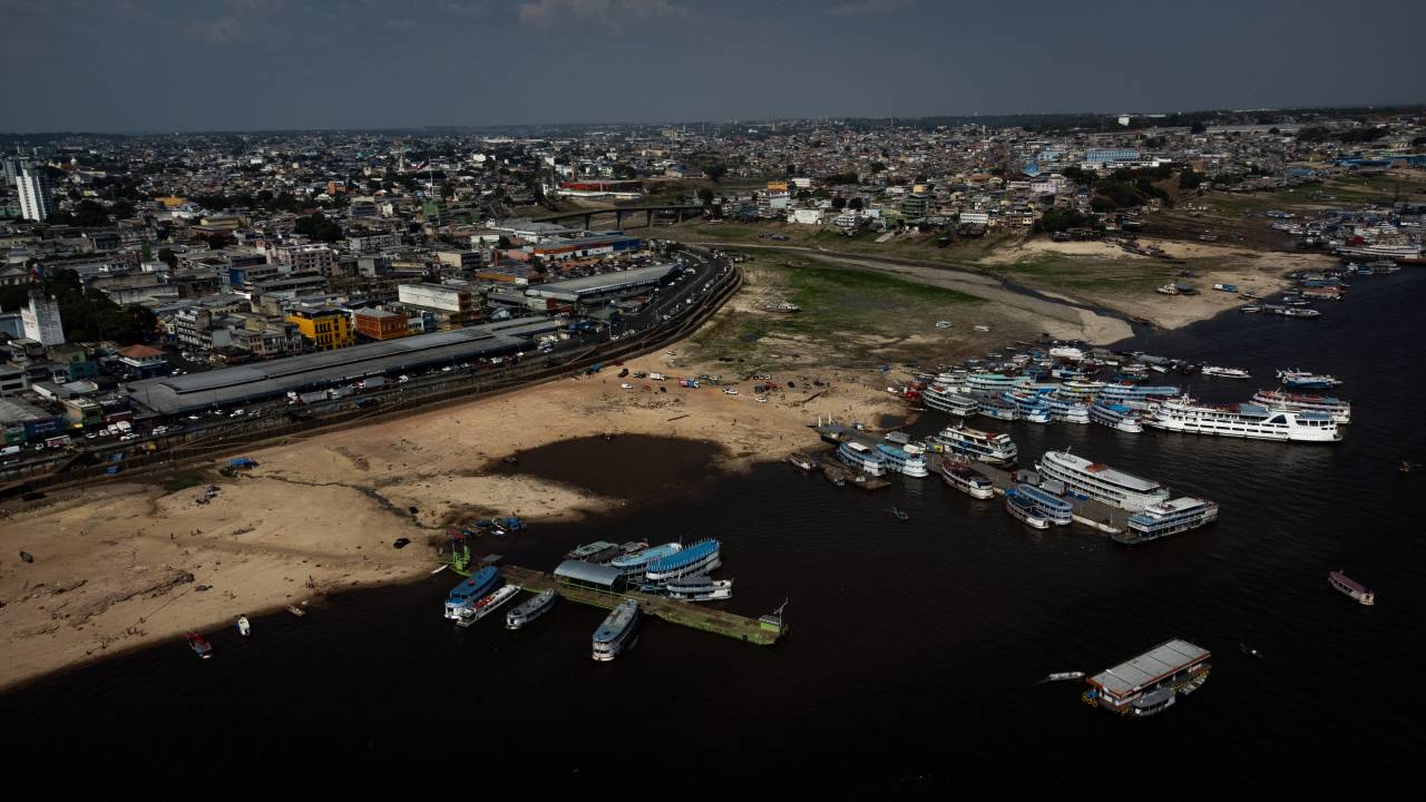 MANAUS, BRAZIL - OCTOBER 3: Aerial view of the historic low tide that the Amazon has been experiencing has left part of the Rio Negro dry and with an extensive strip of land where water used to be on October 3, 2023 in Manaus, Brazil. The state of Amazonas remains in emergency due to severe droughts caused by climate change, heat and the El Niño phenomenon, which inhibits the formation of rain clouds. The low river levels have caused the death of a large number of fish and generated water pollution. Some areas surrounding the Amazon River area and its tributaries are not navigable and isolate local communities who have to receive food, medicine and water by air. (Photo by Bruno Zanardo/Getty Images)