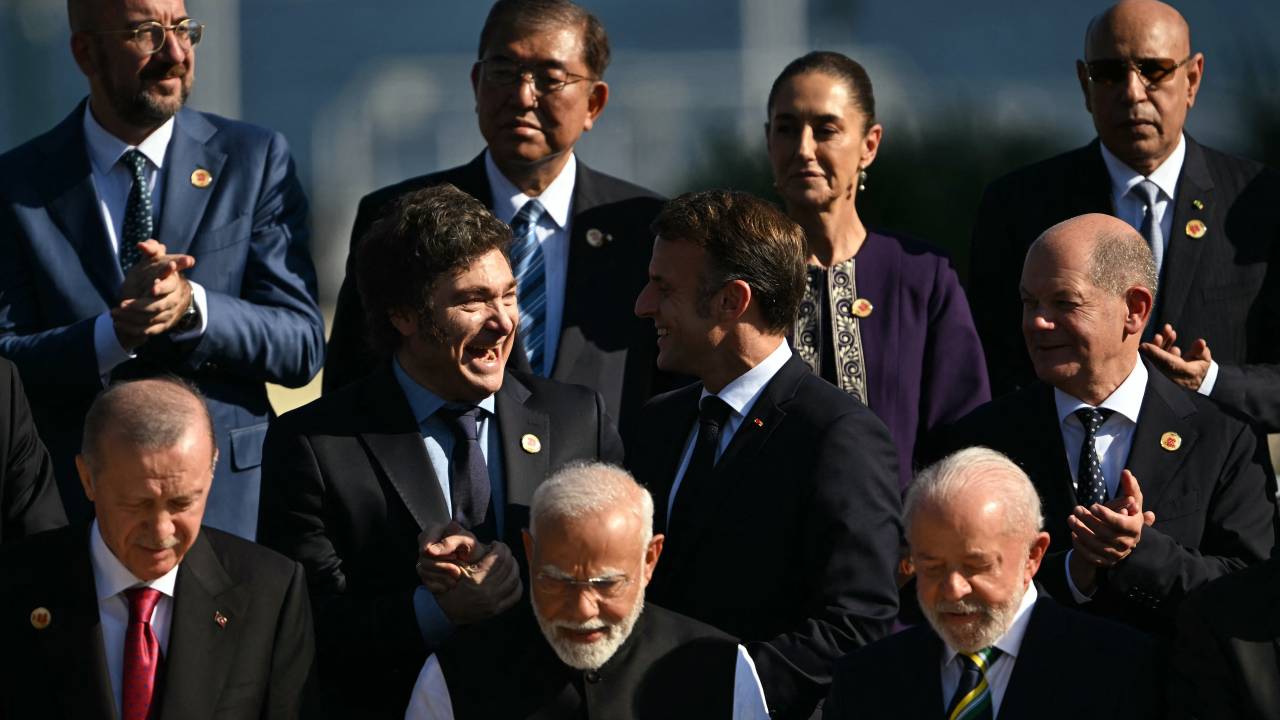 (L to R, front row) Turkey's President Recep Tayyip Erdogan, India's Prime Minister Narendra Modi, Brazil's President Luiz Inacio Lula da Silva, (middle row) Argentina's President Javier Milei, France's President Emmanuel Macron, Germany's Chancellor Olaf Scholz, (back row) the president of the European Council Charles Michel, Japan's Prime Minister Shigeru Ishiba, Mexico's President Claudia Sheinbaum, and Mauritania's President and president of the African Union Mohamed Ould Ghazouani pose for a group photo after the first session of the G20 Leaders' Meeting in Rio de Janeiro, Brazil, on November 18, 2024. (Photo by Mauro PIMENTEL / AFP)