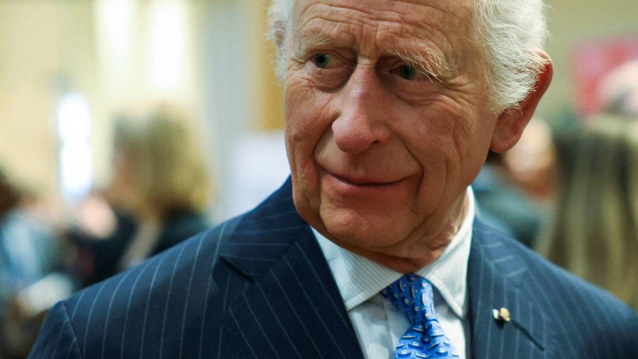 Britain's King Charles III reacts as he meets Disasters Emergency Committee (DEC) staff, aid workers and volunteers at St Peters Church, in London, on December 4, 2024. (Photo by Mina Kim / POOL / AFP)
