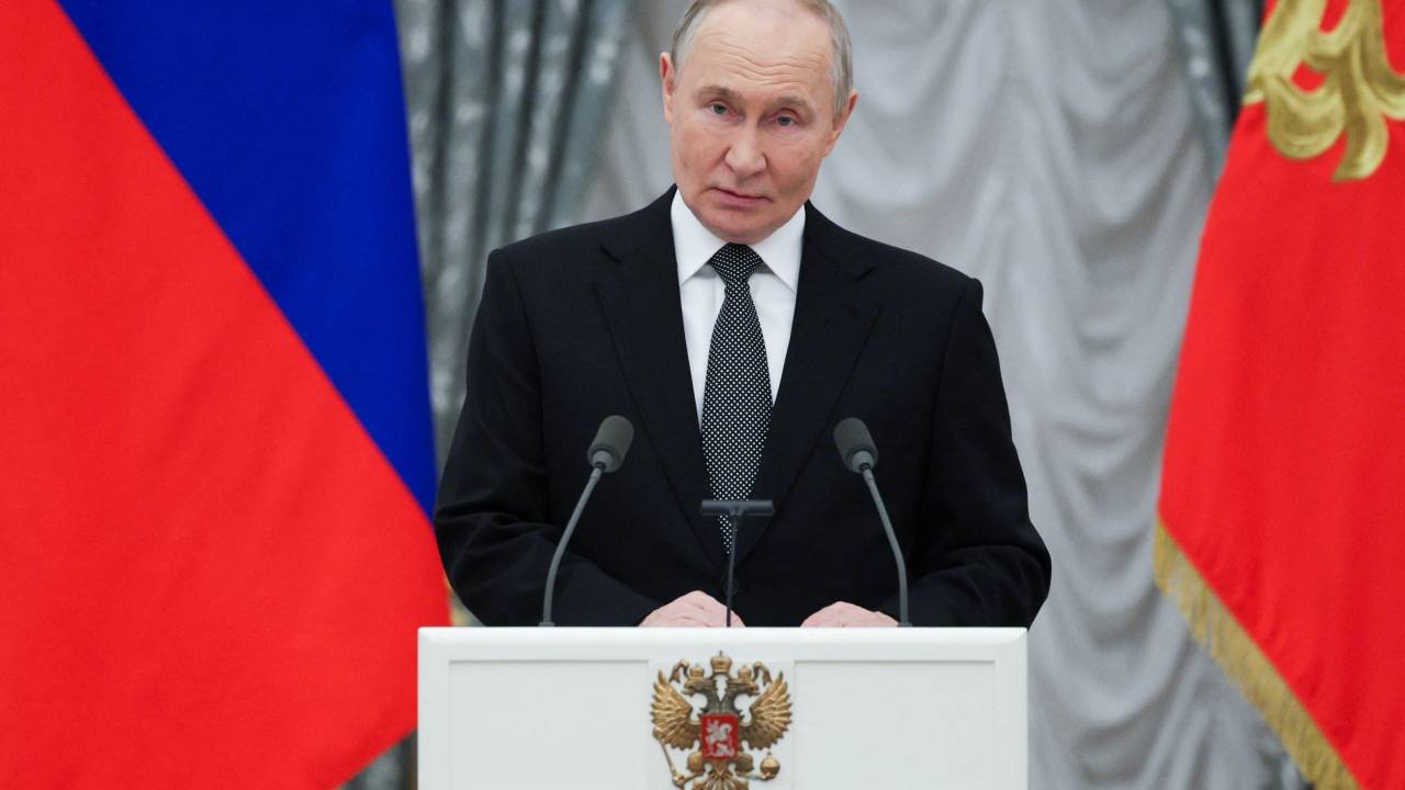 In this pool photograph distributed by the Russian state agency Sputnik, Russia's President Vladimir Putin makes a speech during an awards ceremony in the Kremlin, in Moscow on December 12, 2024. (Photo by Gavriil Grigorov / POOL / AFP)